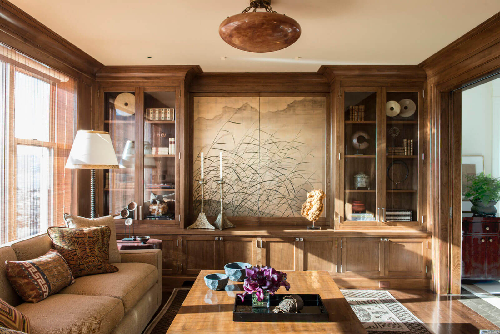 A room with a wooden bookcase