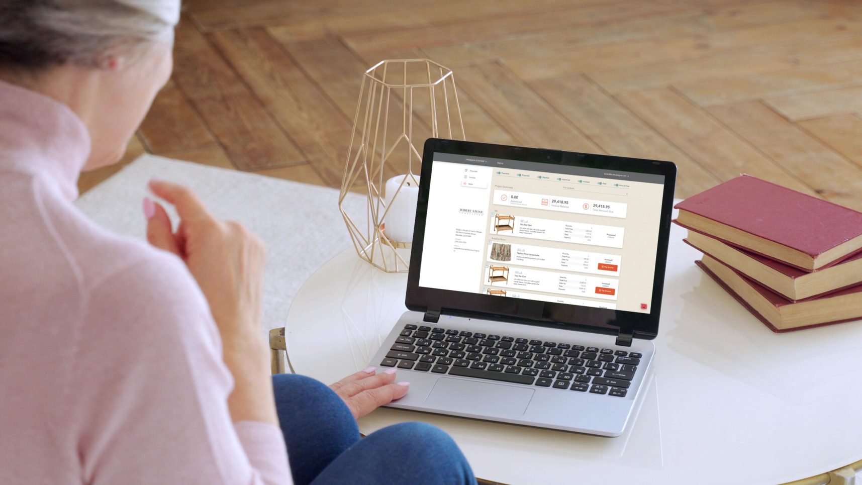 A woman using the Studio Designer application on her laptop