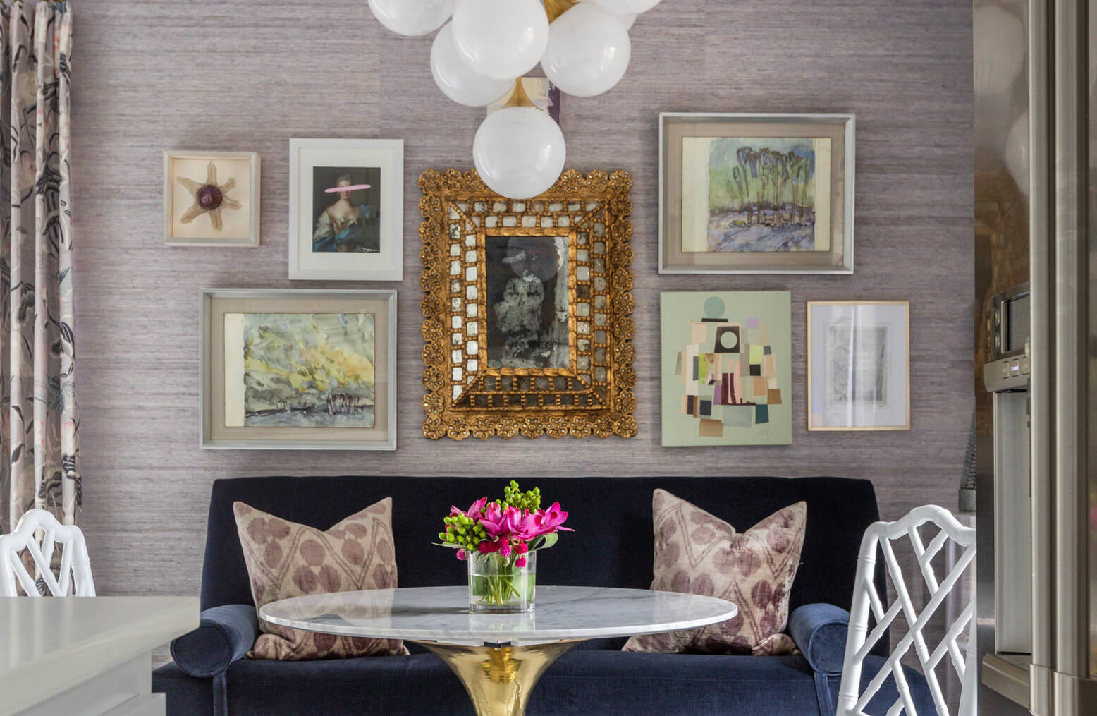 Pictures in original frames above the sofa in the living room