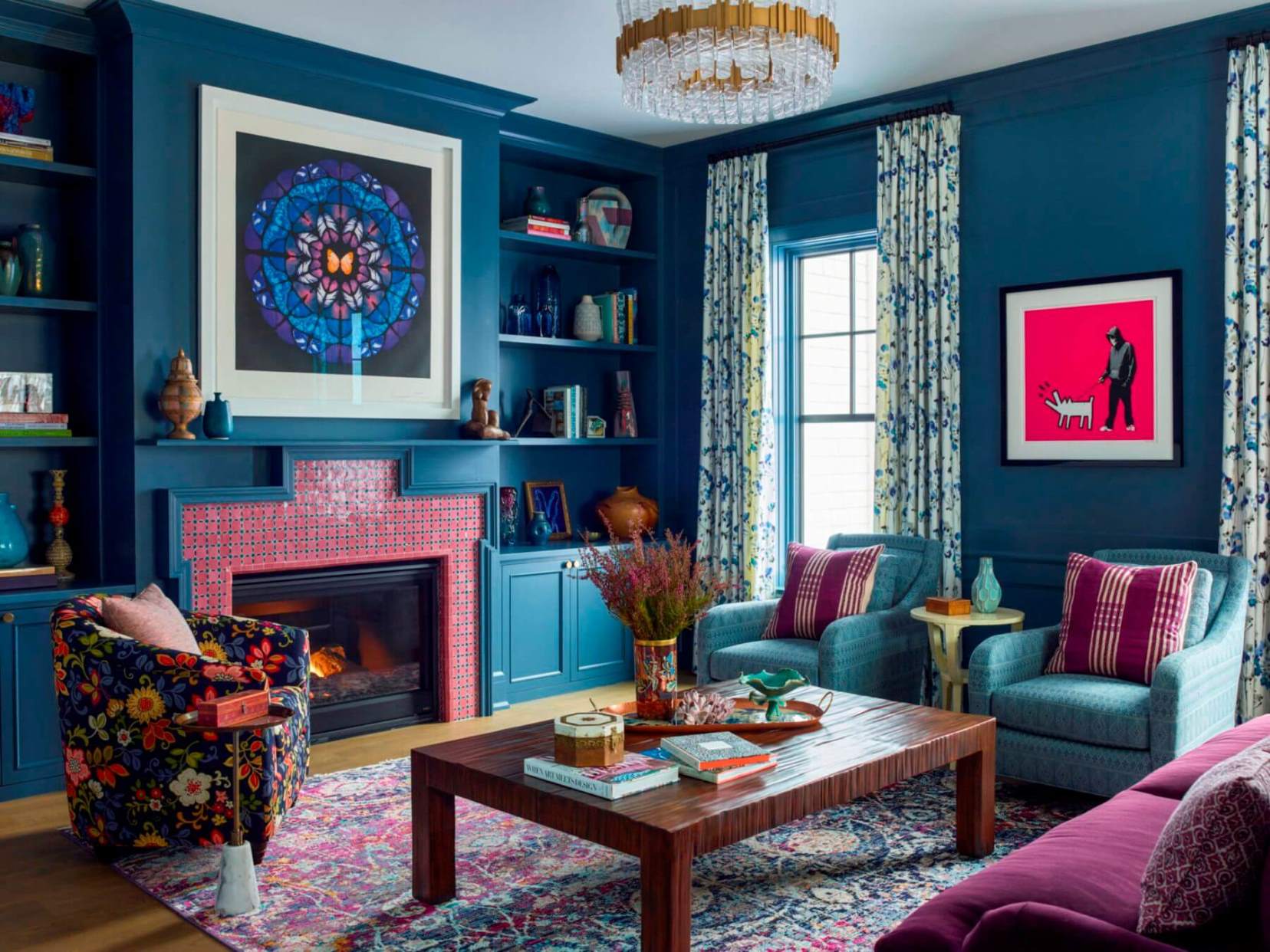 Living room with deep blue walls and colorful accents