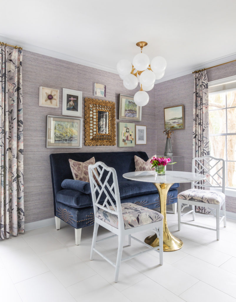 A small living room with lots of paintings