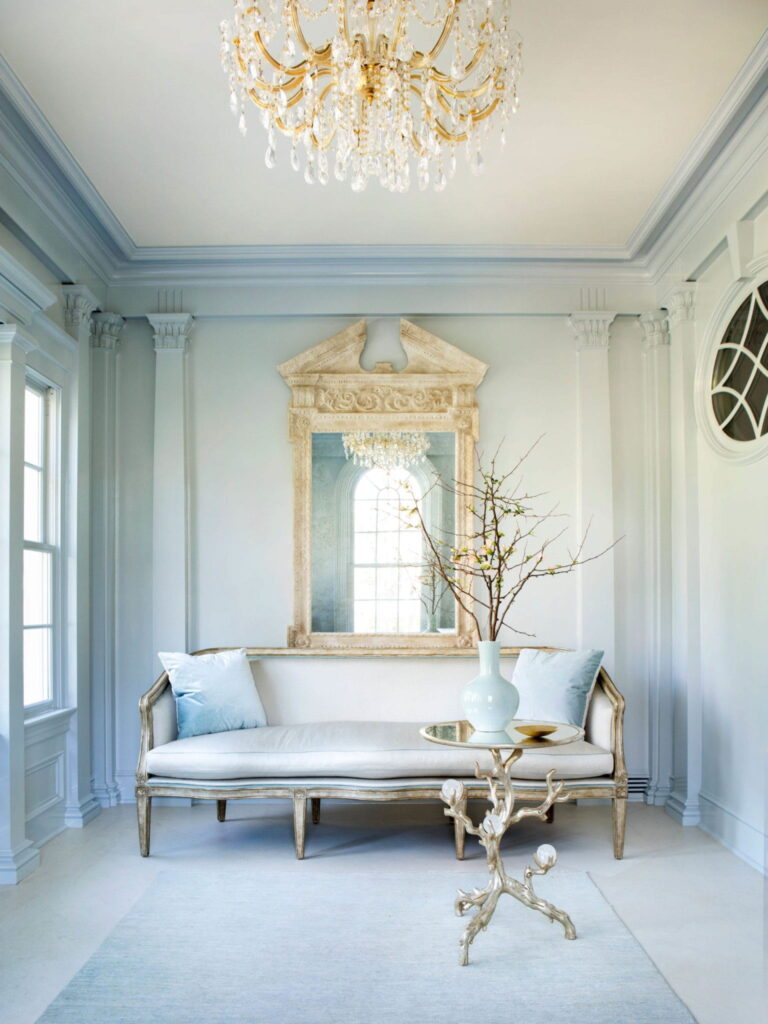 Elegant style sofa in the hall with light blue walls
