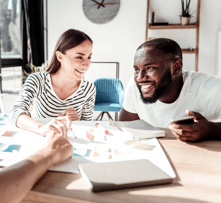 Young couple discussing a project with the interior designer