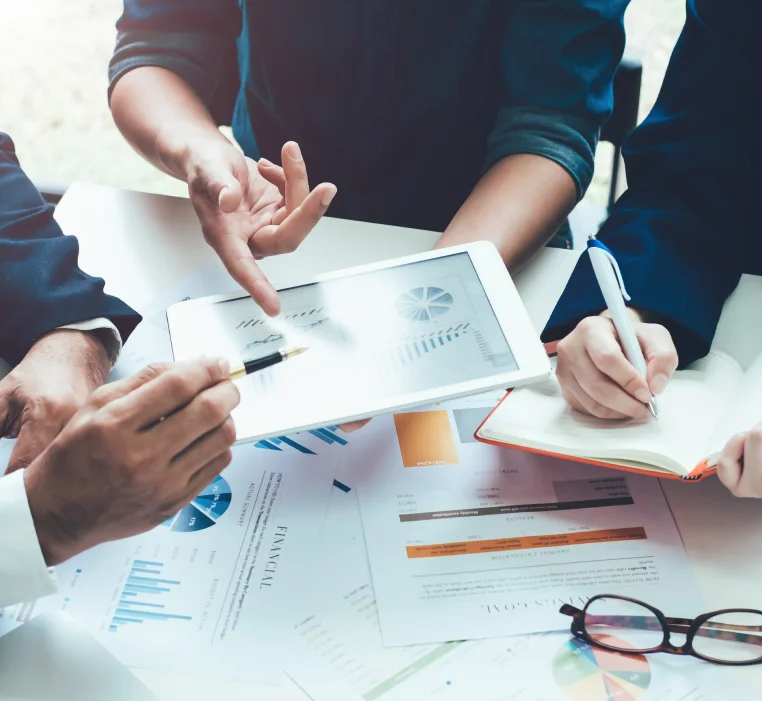 People looking at a chart on the tablet