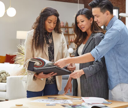 People looking at a catalog