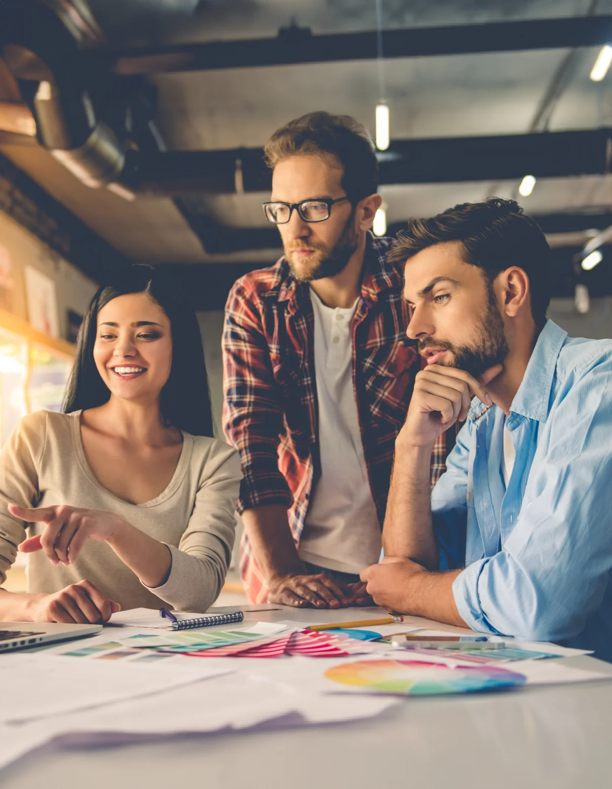 Three people working on the project